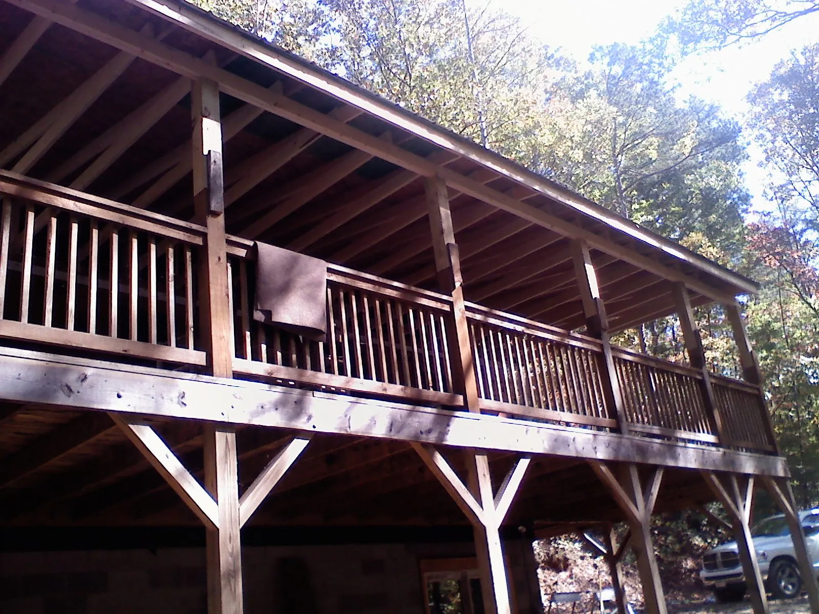 Timber framing under a new elevated porch and deck — Roof Leak Repair in Booneville by Roofing Brothers